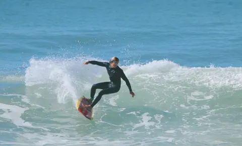 Surfer carving a turn
