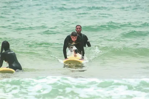 Beginner surf lesson in the whitewater in Tamraght
